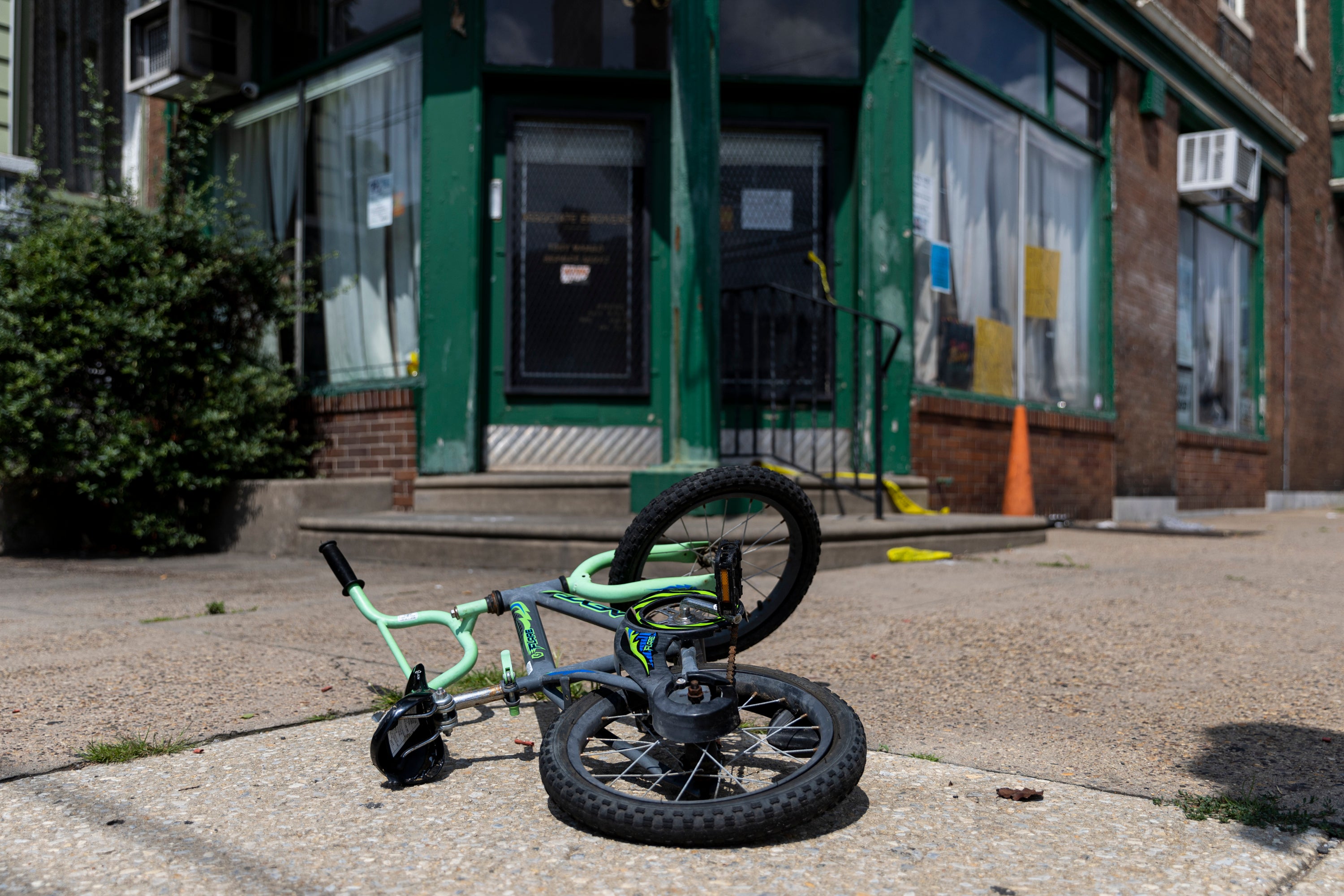 A child’s bike left at the scene of a shooting in Philadelphia that claimed five lives on Monday night