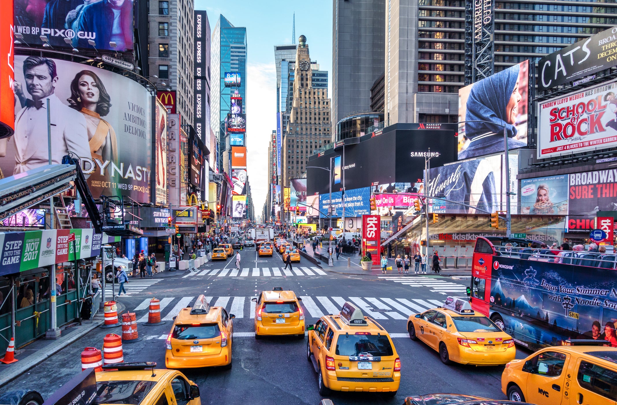 Iconic yellow taxis in lively Times Square