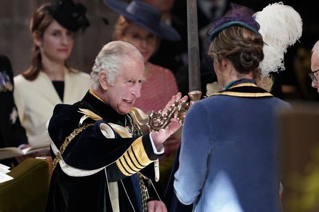 The King is presented with the Elizabeth Sword by Dame Katherine Grainger (Andrew Milligan/PA)