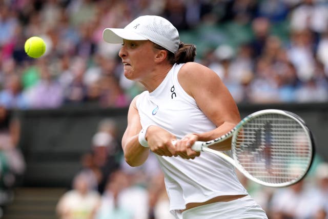 Iga Swiatek booked her place in the third round of Wimbledon before some first-round matches had started (John Walton/PA)