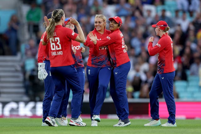 Sarah Glenn celebrates with teammates after taking the wicket of Alyssa Healy (Steven Paston/PA)