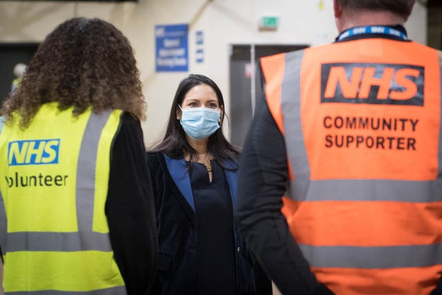 <p>Volunteers were vital for the NHS during the Covid-19 pandemic (Stefan Rousseau/PA)</p>