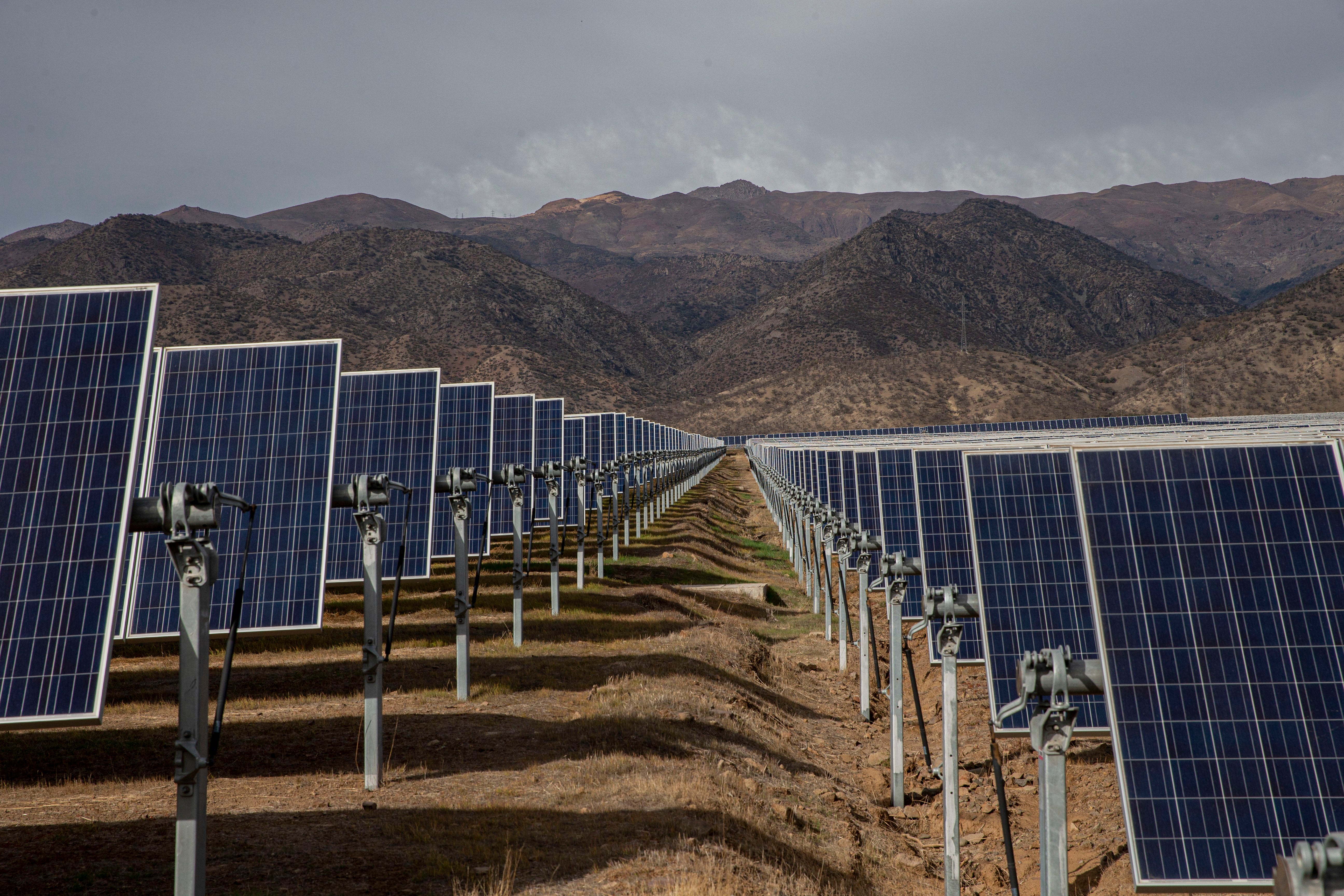 Solar panels stand in the Quilapilún solar energy plant, a joint venture by Chile and China, in Colina, Chile