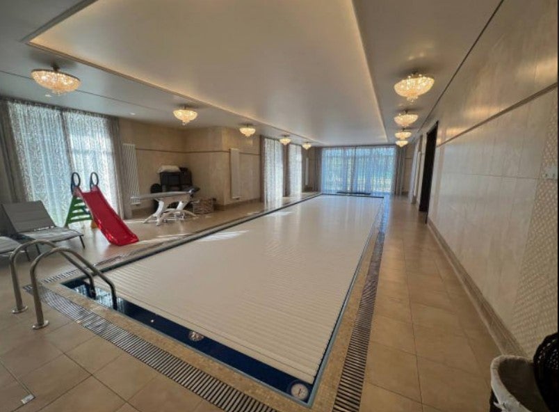 <p>An indoor swimming pool is pictured following a raid on Yevgeny Prigozhin’s St Petersburg mansion </p>