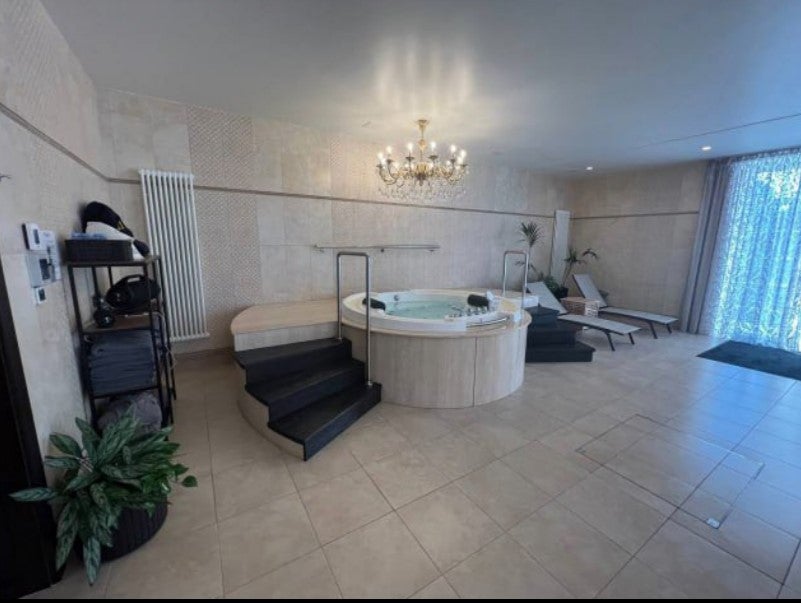 The mansion includes a lengthy indoor swimming pool complete with a bathing area, slides and even a jacuzzi