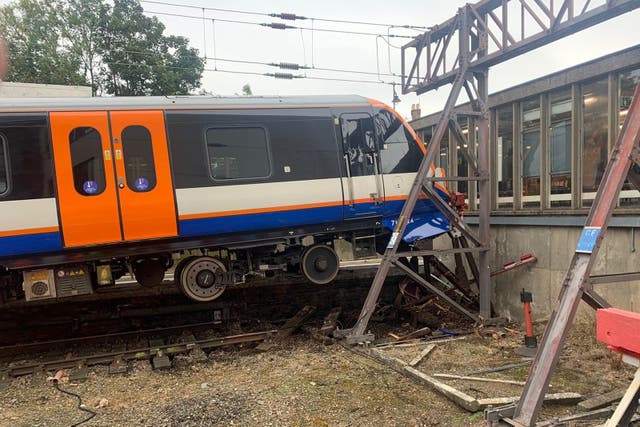 The train came to rest just short of the ticket hall at Enfield Town station (London Fire Brigade/PA)