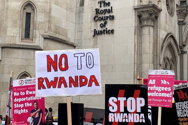 Protesters opposed to the Government’s plan to send asylum seekers to Rwanda gather outside the Royal Courts of Justice in London (Tom Pilgrim/PA)
