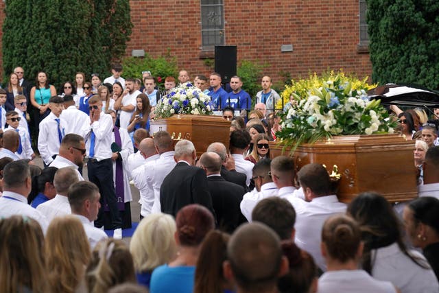 The coffins of Kyrees Sullivan and Harvey Evans are carried into the Church of the Resurrection in Ely (Jacob King/PA)