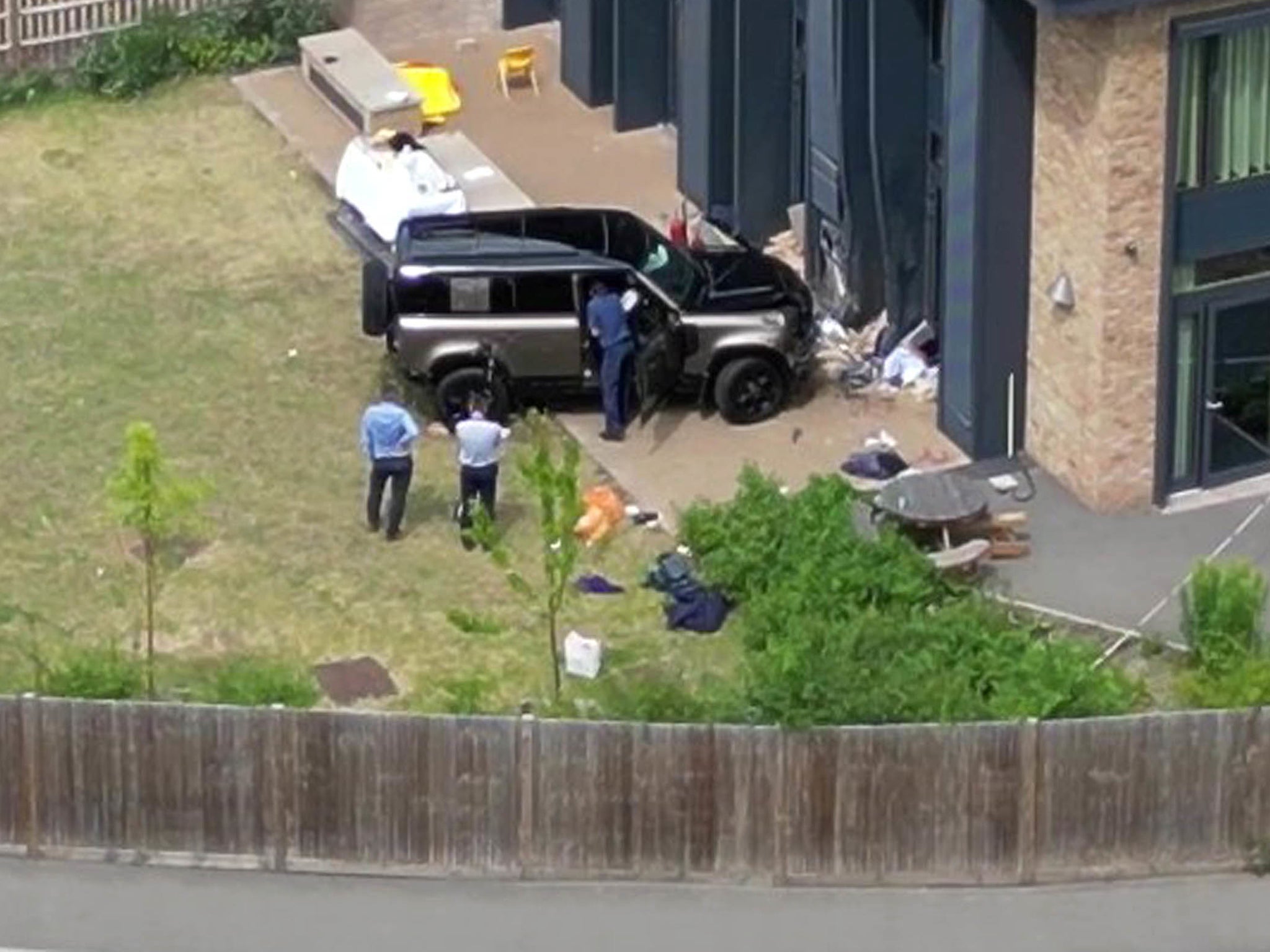 The gold Land Rover crashed through the school gates and killed two pupils