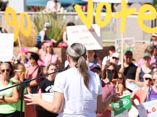 <p>Arizona Secretary of State and Democratic gubernatorial candidate Katie Hobbs speaks at a Women's March rally in support of midterm election candidates who support abortion rights outside the State Capitol on October 8, 2022 in Phoenix, Arizona</p>