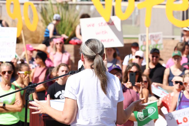 <p>Arizona Secretary of State and Democratic gubernatorial candidate Katie Hobbs speaks at a Women's March rally in support of midterm election candidates who support abortion rights outside the State Capitol on October 8, 2022 in Phoenix, Arizona</p>