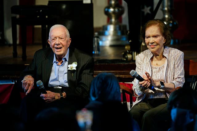 <p>Former President Jimmy Carter and his wife former first lady Rosalynn Carter sit together during a reception to celebrate their 75th wedding anniversary Saturday, July 10, 2021, in Plains, Ga</p>