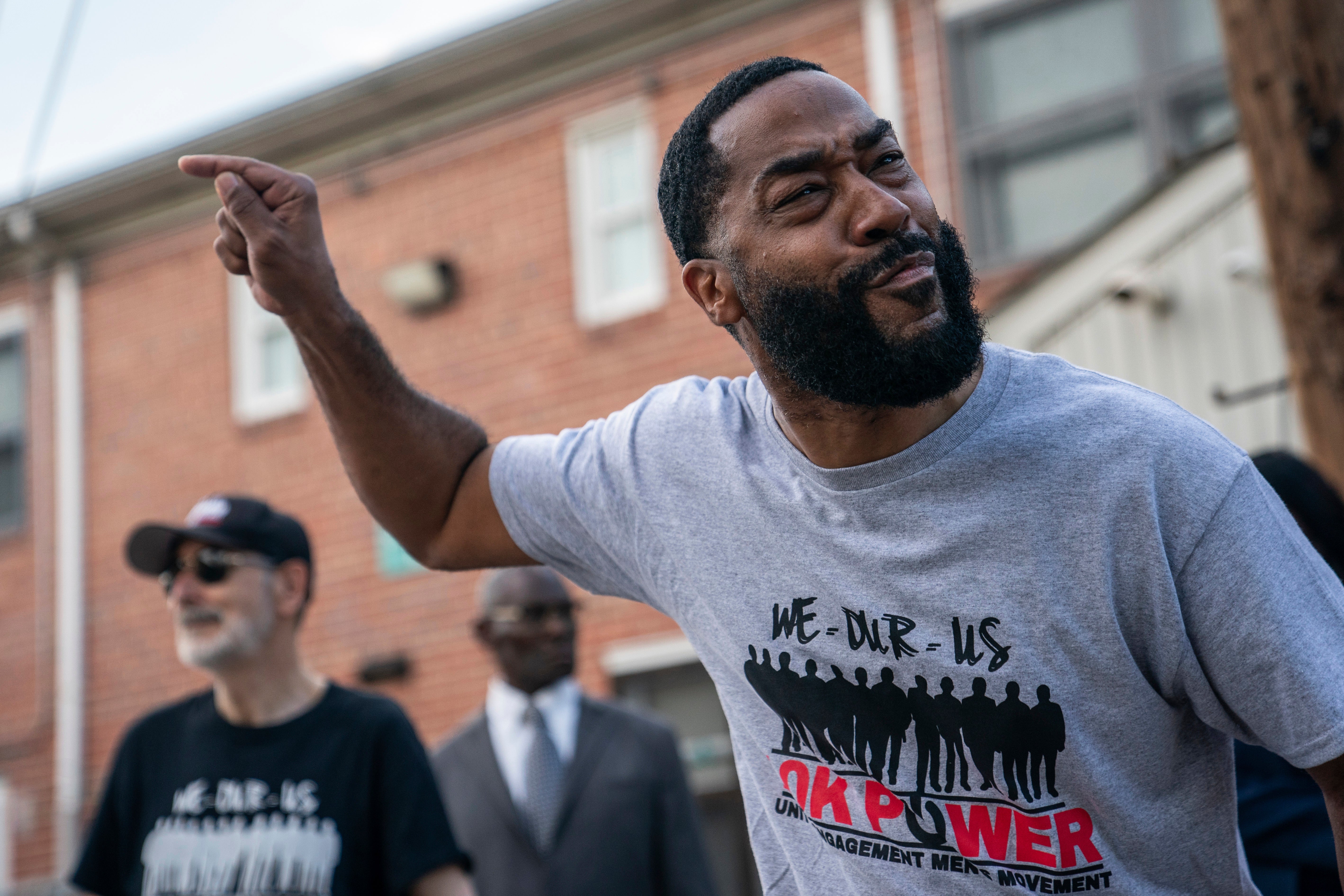 Rev. Shawn Freeman speaks during a prayer gathering at the site of a mass shooting in the Southern District of Baltimore, July 3