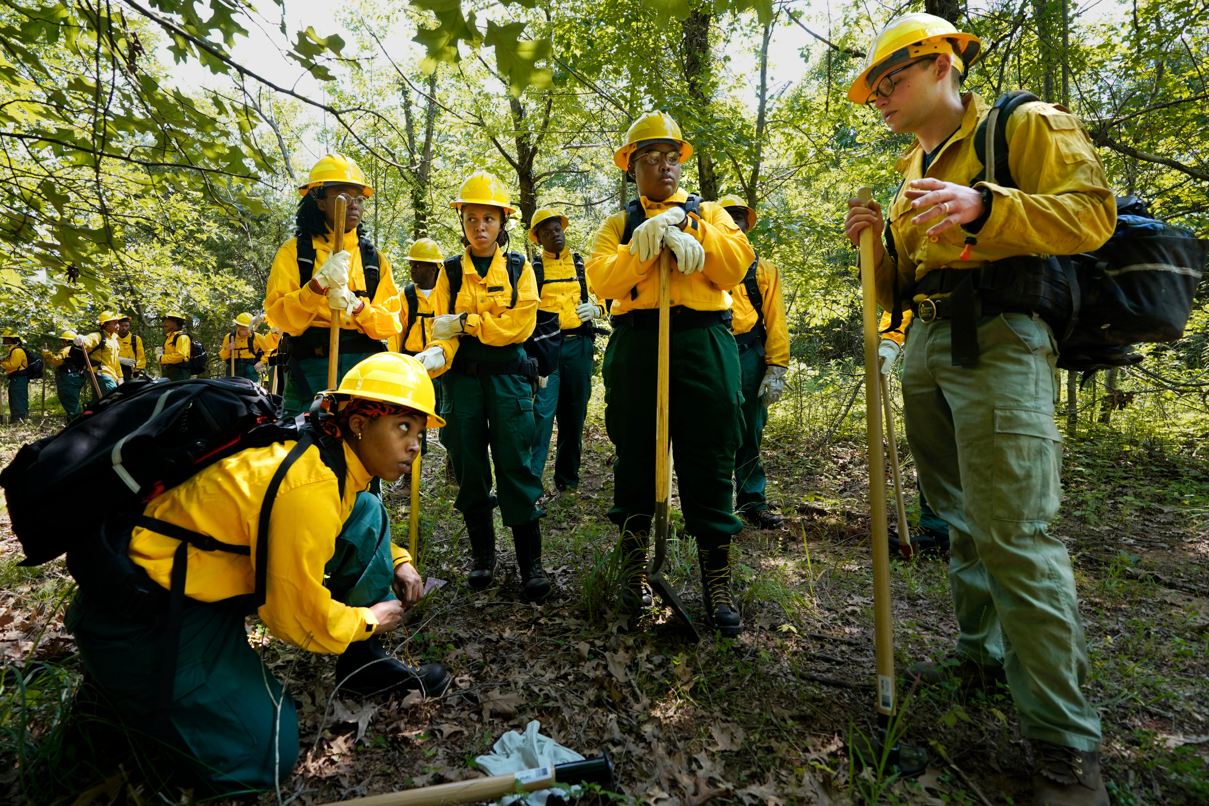 Ben McLane, pictured right, during a wildland firefighter training in June 2023 in Hazel Green, Alabama