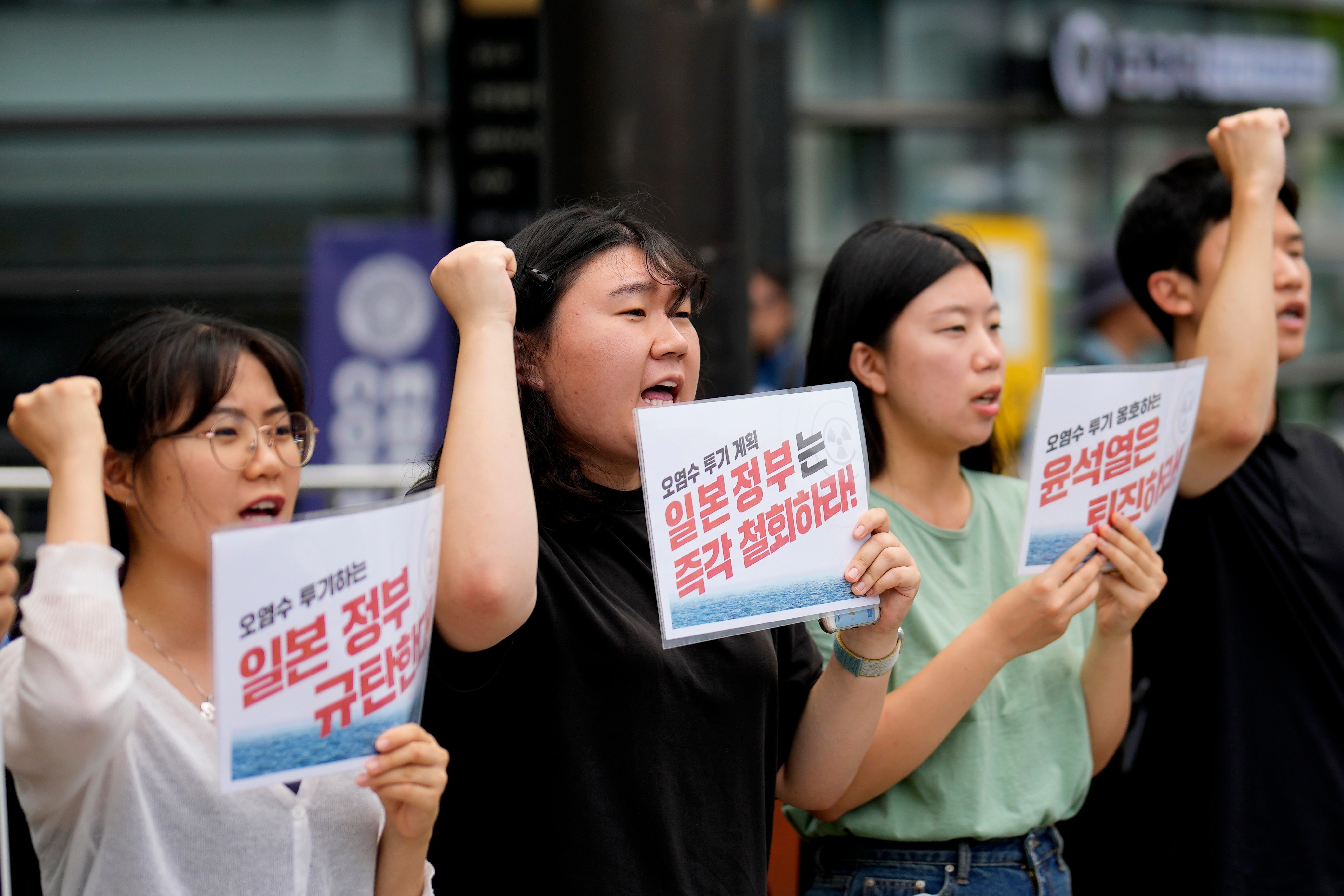 Students shout slogans during a rally to oppose the Japanese government's plan to release treated radioactive water into the sea from the Fukushima nuclear power plant, in Seoul, South Korea
