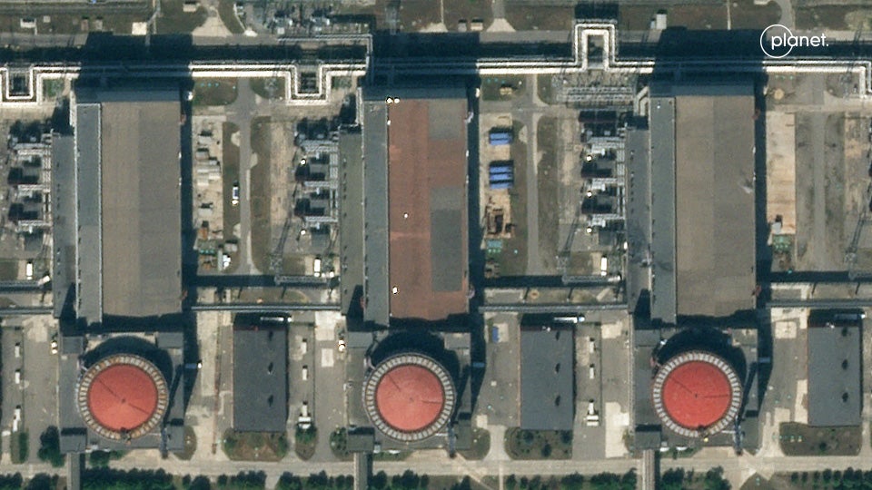 Five white shapes are seen topping Zaporizhzhia power plant