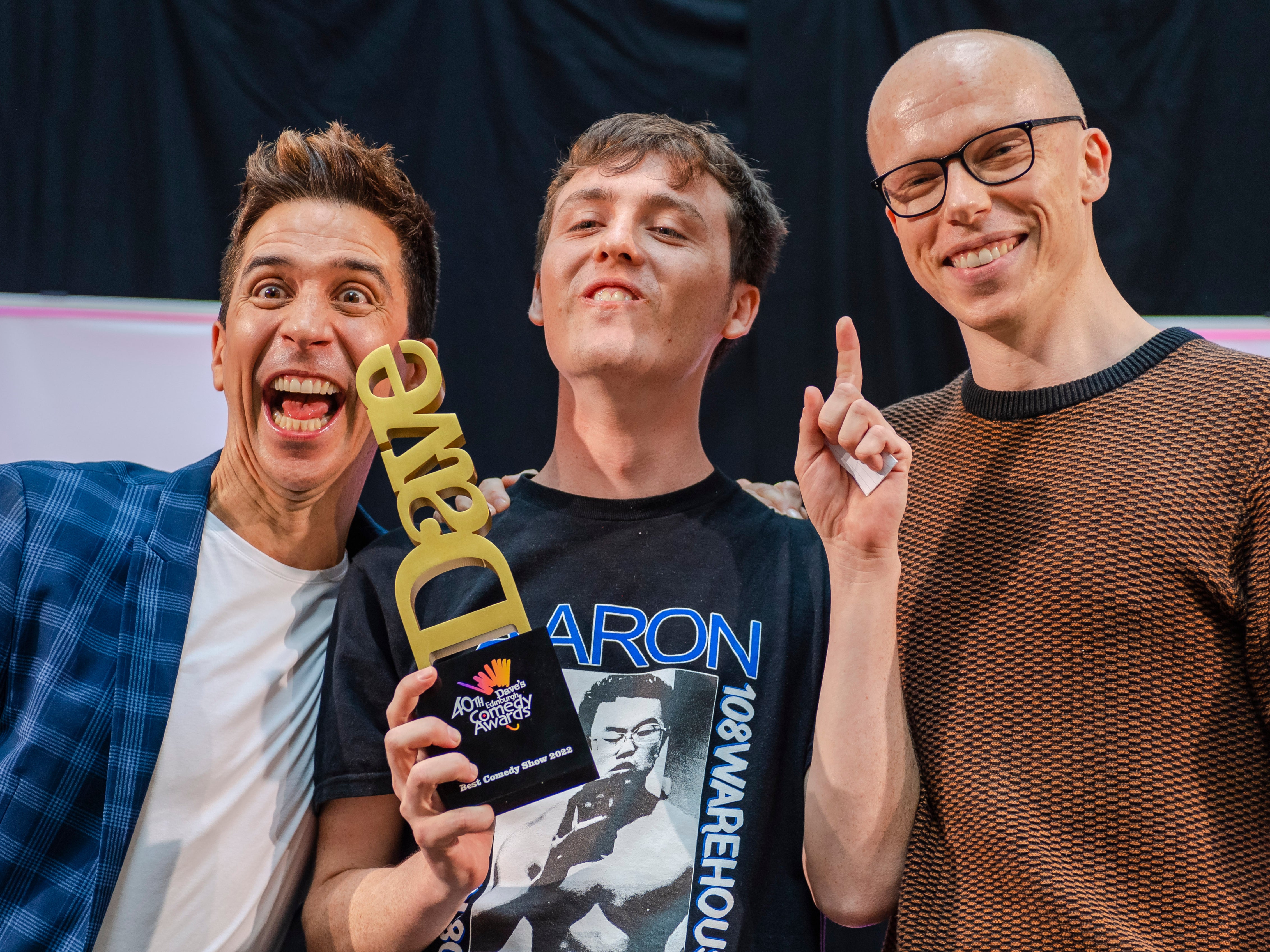 <p>2022 Best Comedy Show winner Sam Campbell (centre) with previous winners Russell Kane (left) and Jordan Brookes</p>