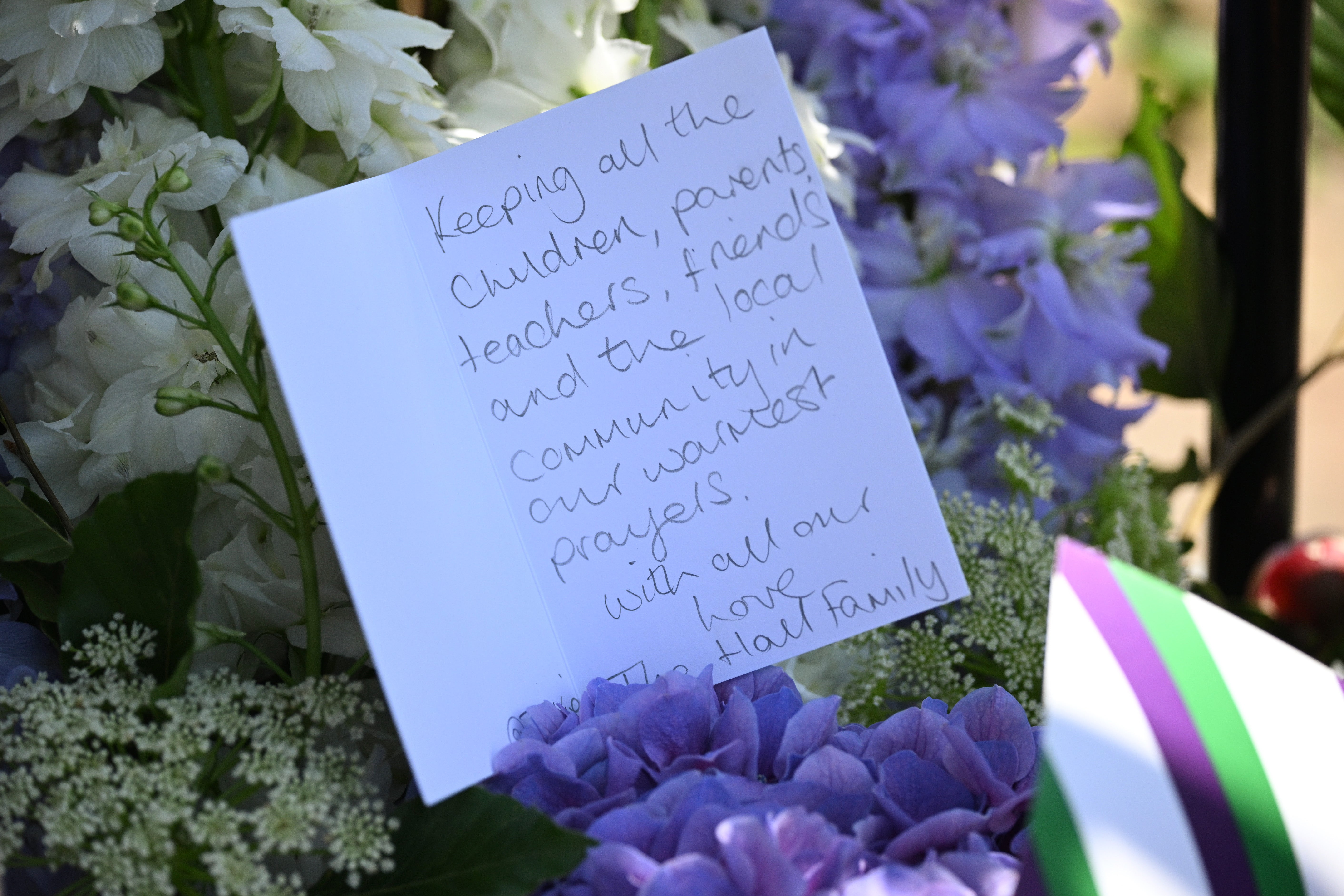 A note in tribute to the victims of a car crash is seen outside The Study Preparatory School on Camp Road on July 7, 2023 in Wimbledon, England.