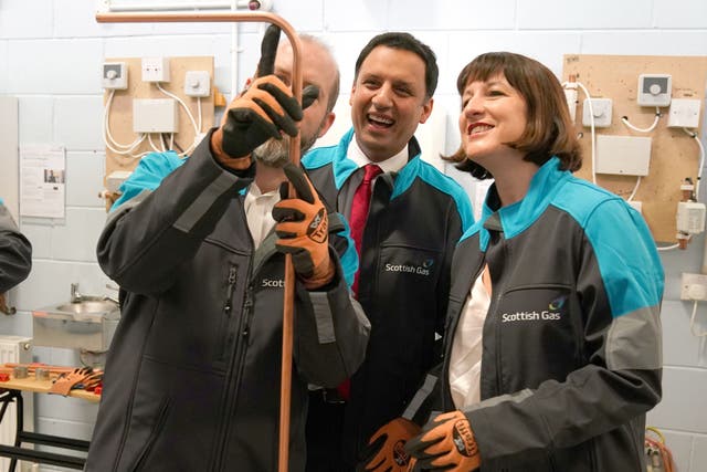Scottish Labour leader Anas Sarwar and Shadow Chancellor Rachel Reeves discussed the two-child policy during a visit with shadow business secretary Jonathan Reynolds to the Scottish Gas Academy in Hamilton (Andrew Milligan/PA)