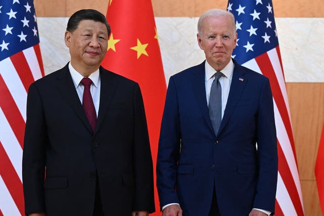 <p>Joe Biden, right, and Xi Jinping met on the sidelines of a G20 summit late last year – but the economic tit-for-tat has continued between the US and China</p>
