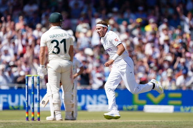 Stuart Broad, right, celebrates after taking the wicket of Australia’s David Warner (Mike Egerton/PA)