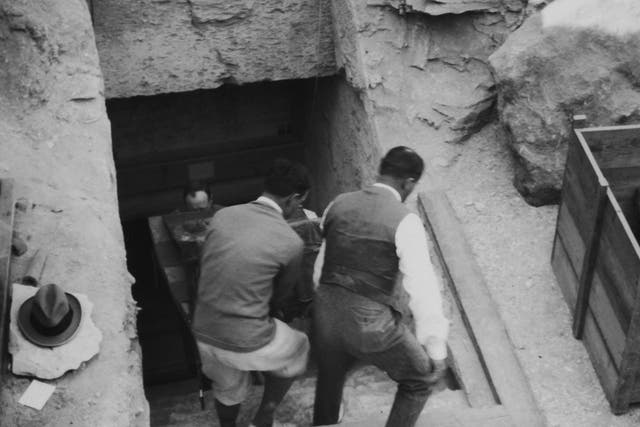 <p>Crates are brought out of the newly discovered tomb of Tutankhamun in the Valley of the Kings, Luxor, in 1923 </p>