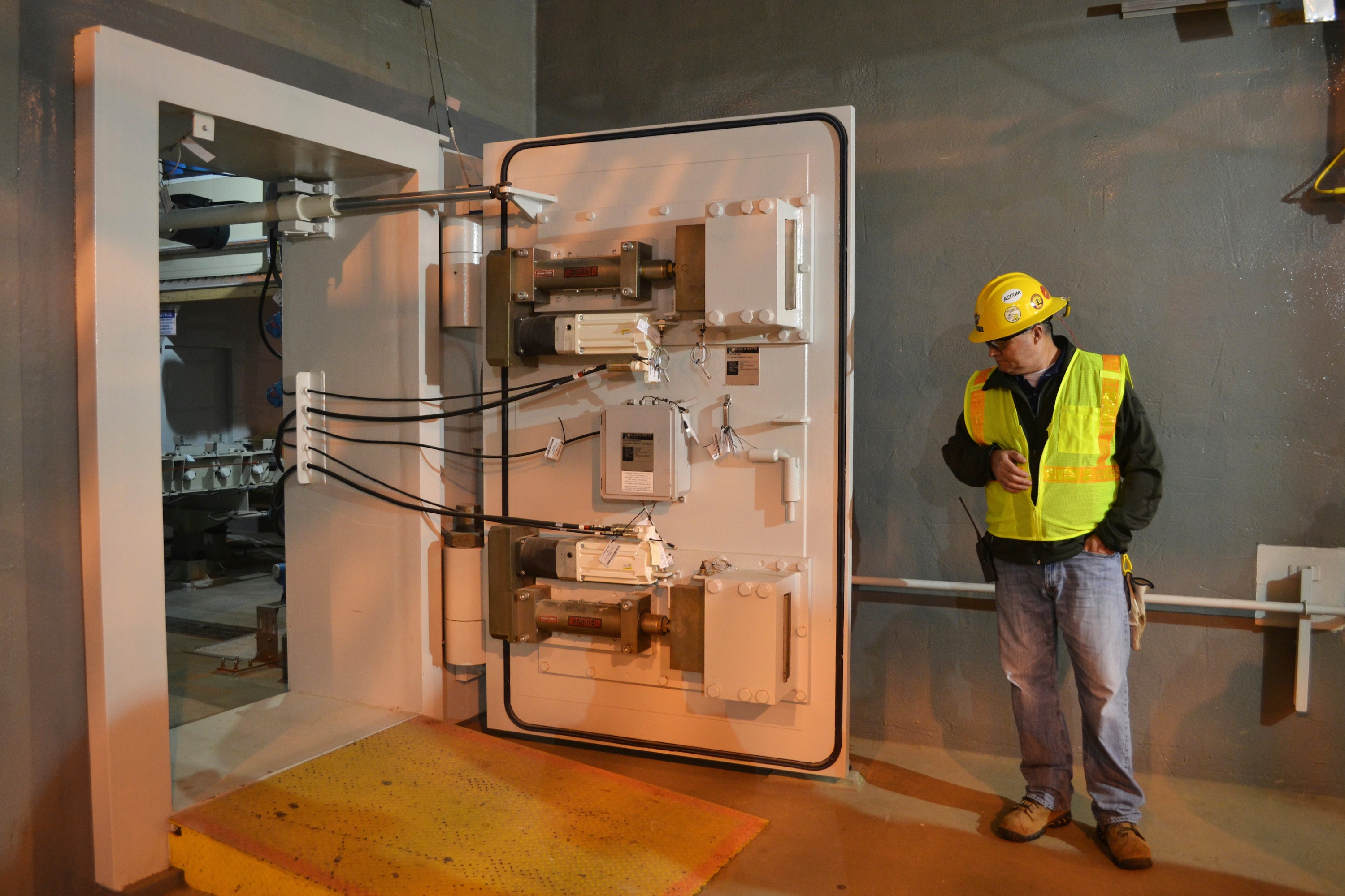 A worker at the Blue Grass Chemical Agent Pilot Plant looks at a blast door inside the facility in Richmond, Kentucky