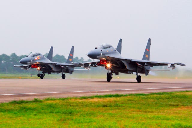 <p>File. In this undated photo released by China’s Xinhua News Agency, two Chinese SU-30 fighter jets take off from an unspecified location to fly a patrol over the South China Sea</p>