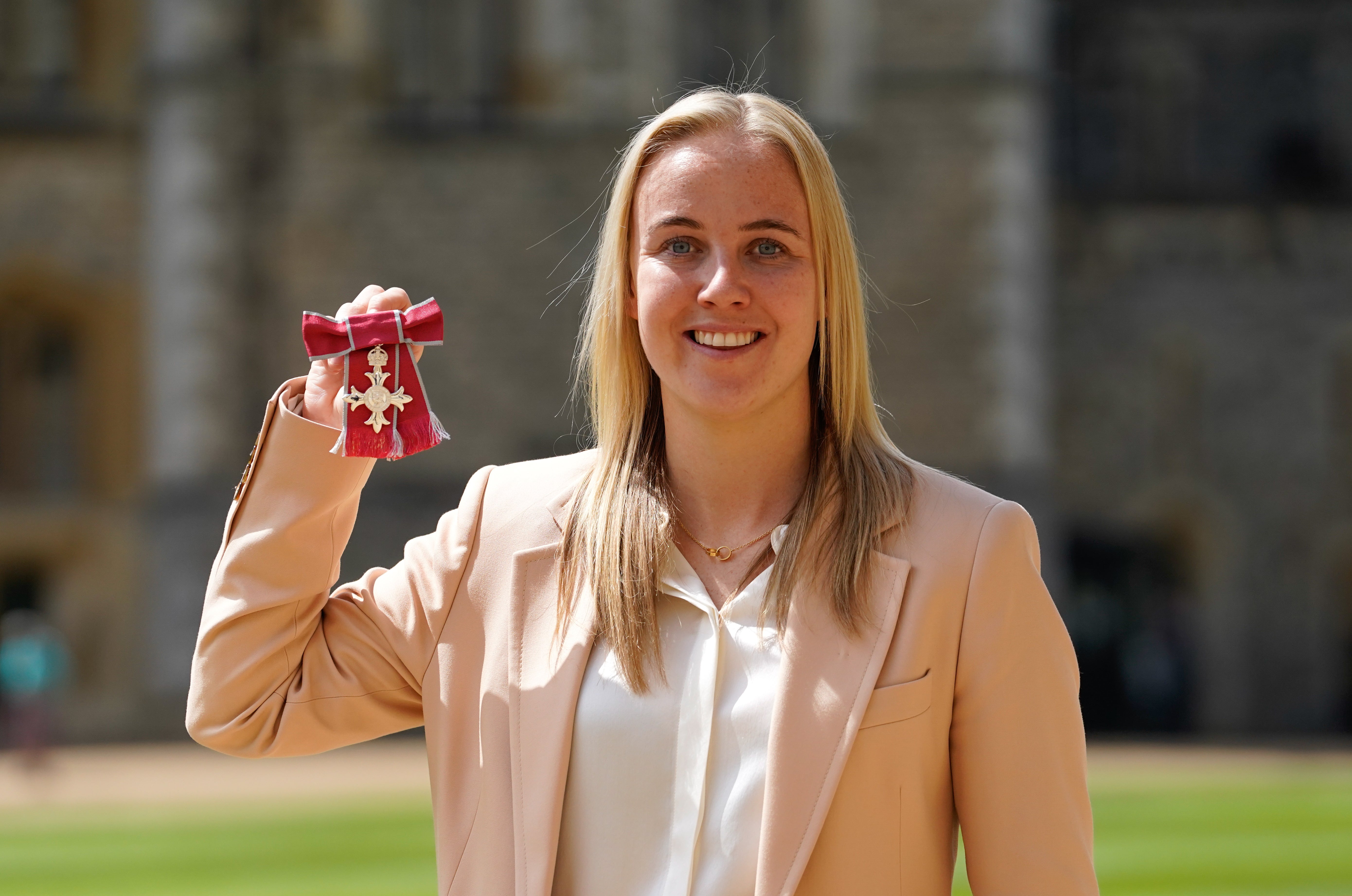 Beth Mead poses after being made a Member of the Order of the British Empire (MBE) by the Prince of Wales, for services to football after winning the 2022 European Championship with England