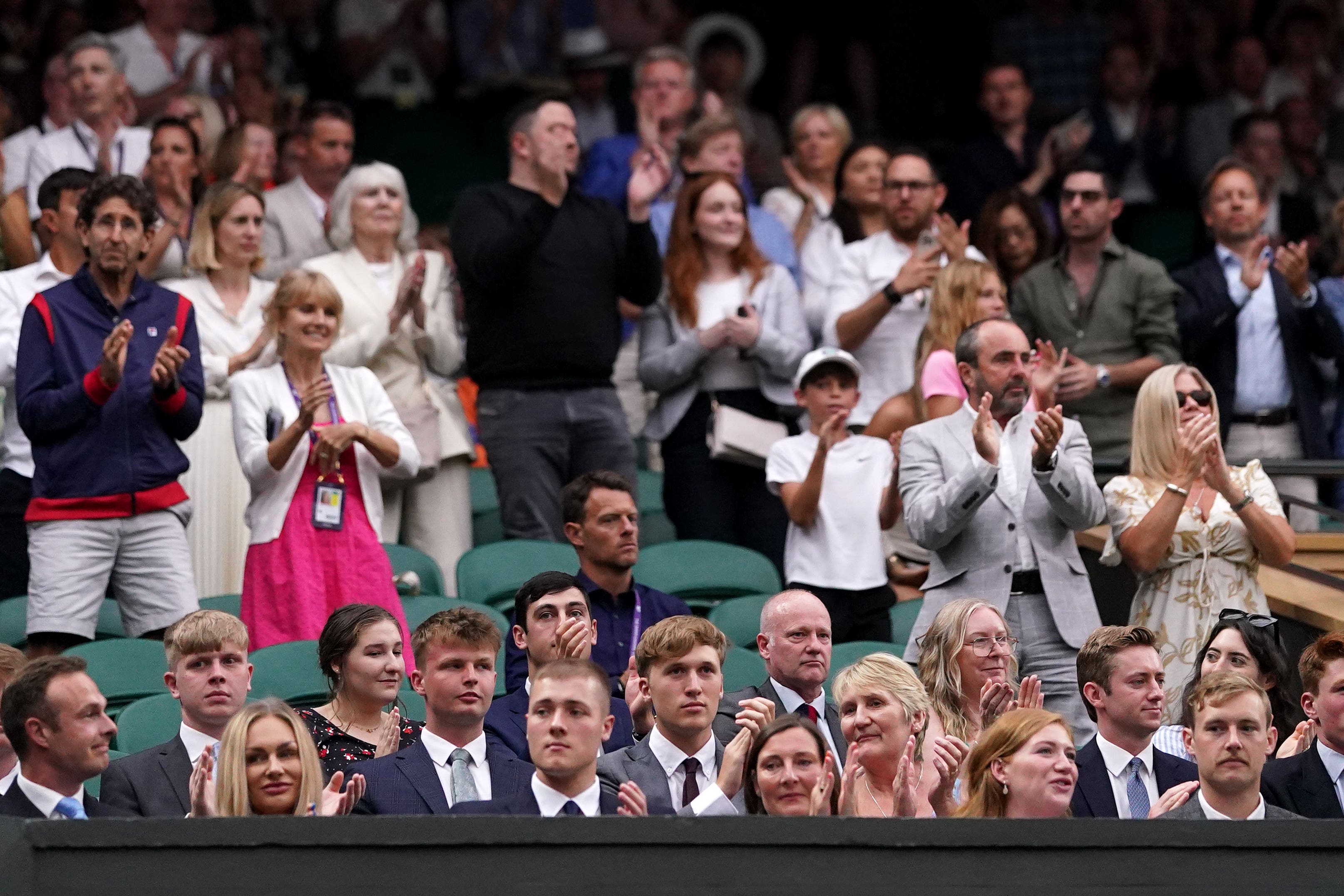 Military personnel including Members of 1st Battalion, Grenadier Guards, who were pallbearers at the funeral in 2022 of Queen Elizabeth II, take seats at Centre Court (Adam Davy/PA)