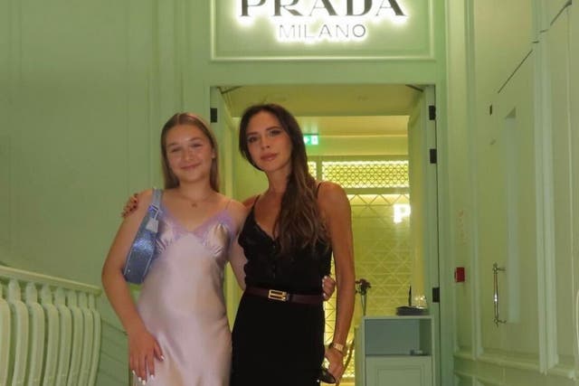 <p>Victoria Beckham poses with her daughter Harper Beckham in front of the Prada Caffe in Harrods, London</p>