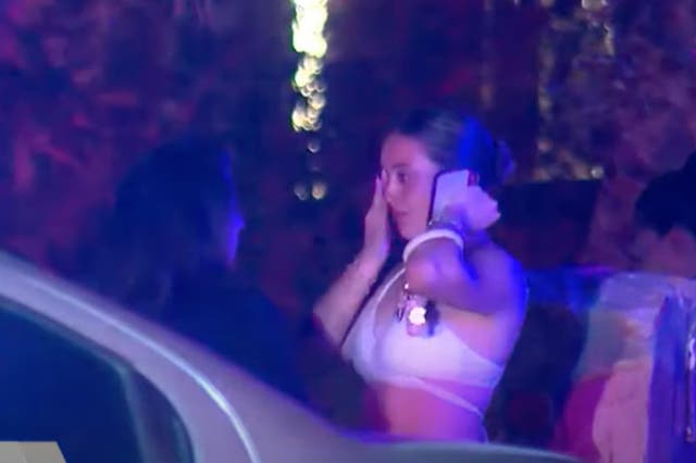 <p>A woman cries while speaking with police in El Paso after a shooting left eight party-goers injured during a Friday night gathering</p>