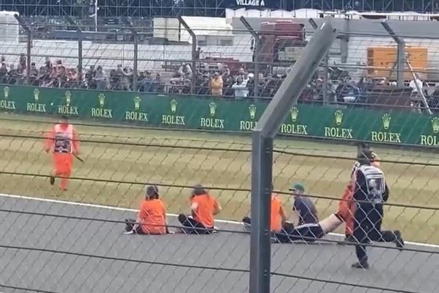 Protesters during a track invasion at last year’s British Grand Prix (Northants Police/PA)