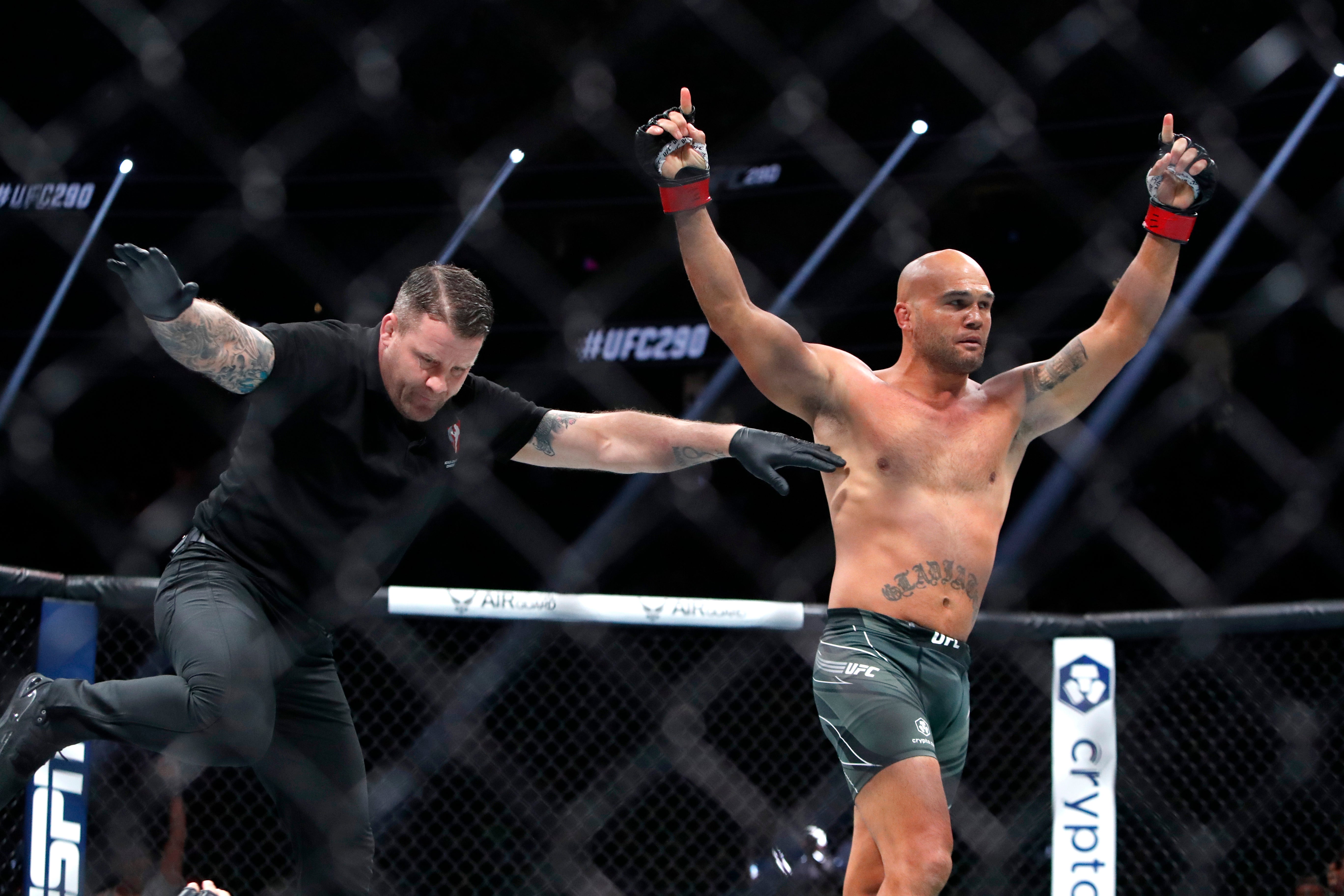 Robbie Lawler celebrates winning his final ever fight with an early knockout