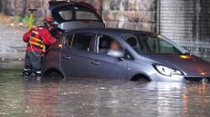 Trapped driver rescued from car as flash flooding hits Liverpool