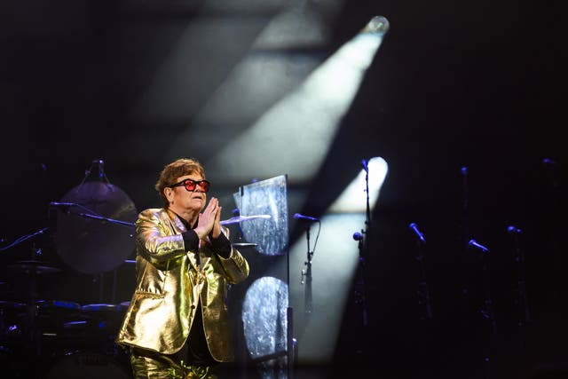<p>Elton John performing at Glastonbury in 2023 </p>
