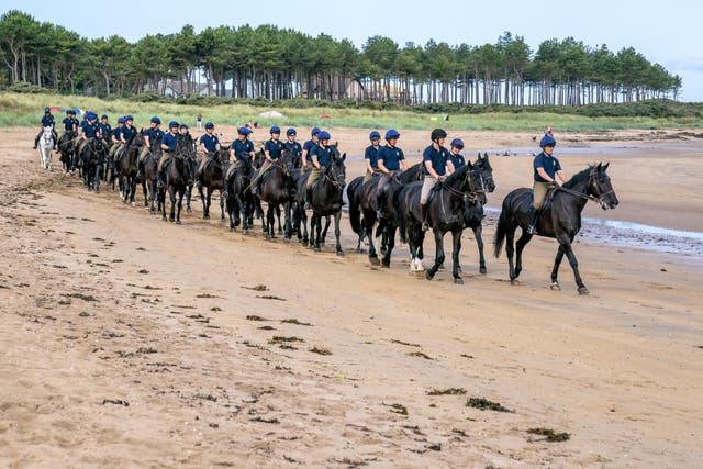 Members of the Household Cavalry, Blues and Royals exercising their horses at Yellowcraig Beach near North Berwick, East Lothian (PA)