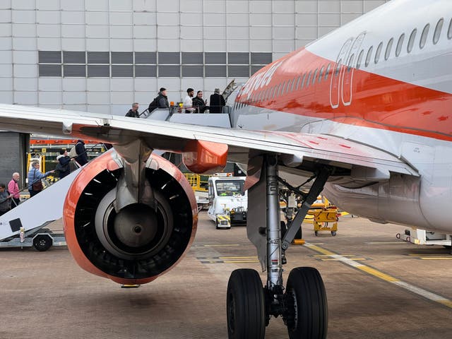 <p>Going places? Passengers boarding an easyJet aircraft at London Gatwick airport, the airline’s main base</p>