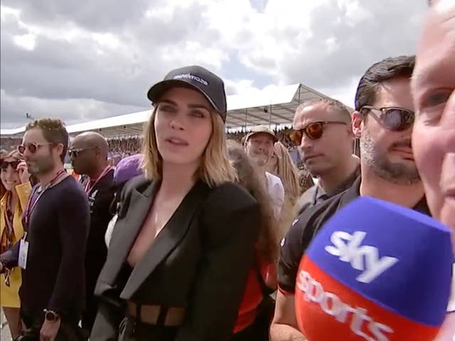 <p>Cara Delevingne and Martin Brundle on F1 grid</p>
