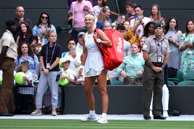 <p>Victoria Azarenka reacts after she is booed off the court at Wimbledon</p>