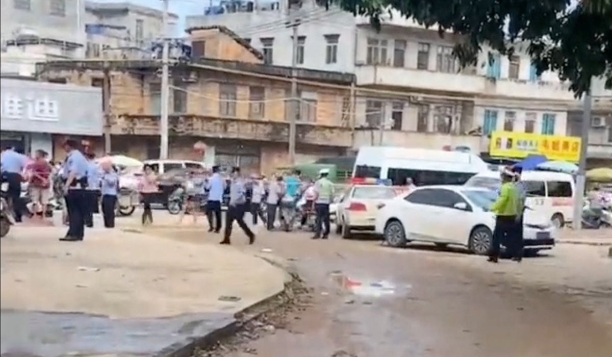 A police cordon is placed in the aftermath of a stabbing attack at a kindergarten in Lianjiang county, Guangdong province