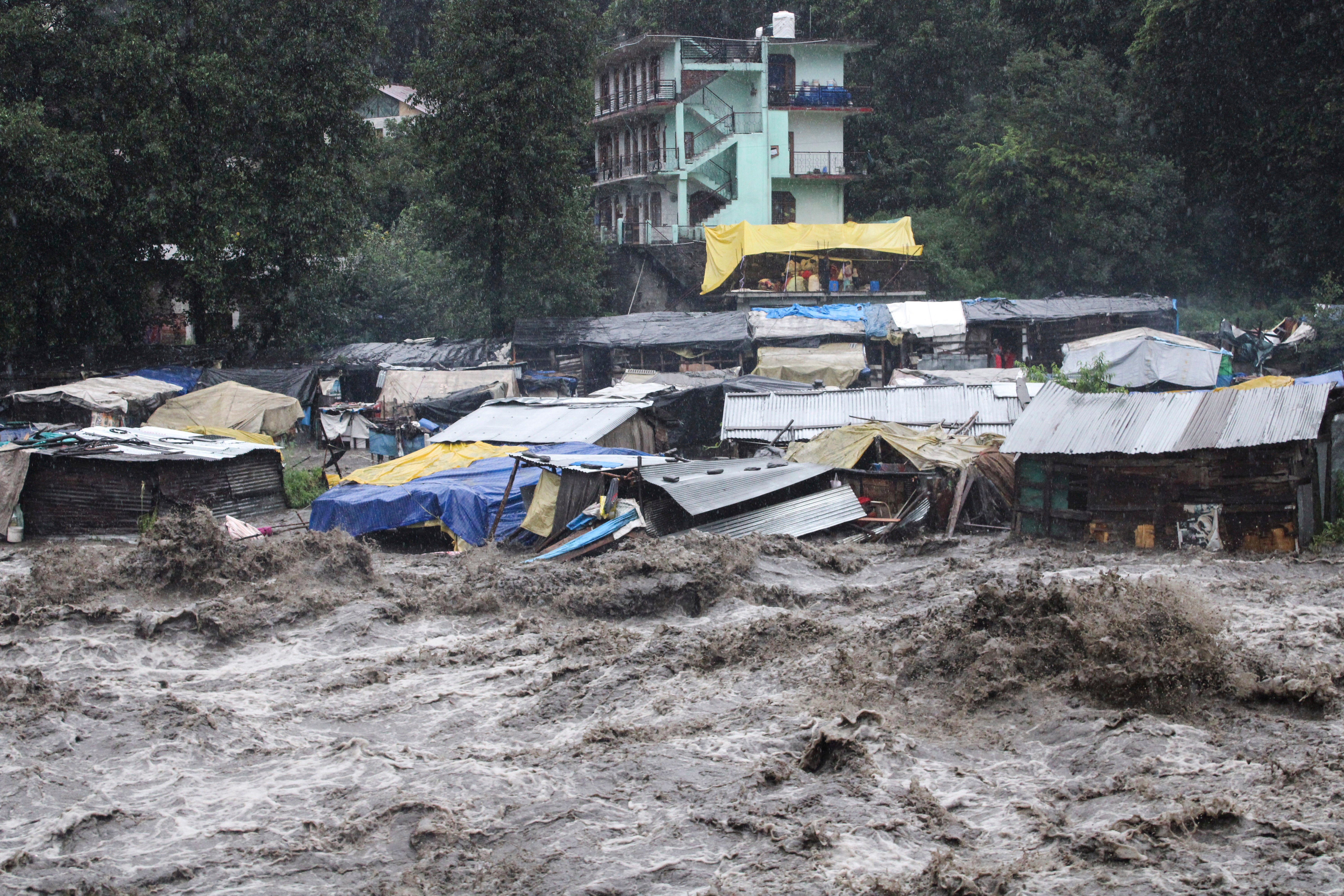 A swollen River Beas following heavy rains in Kullu, Himachal Pradesh, India, on July 9, 2023. Heavy rain fall has triggered landslides, damaged houses and caused loss of lives. Poorer countries facing worsening climate disasters are calling for greater financial support from rich nations