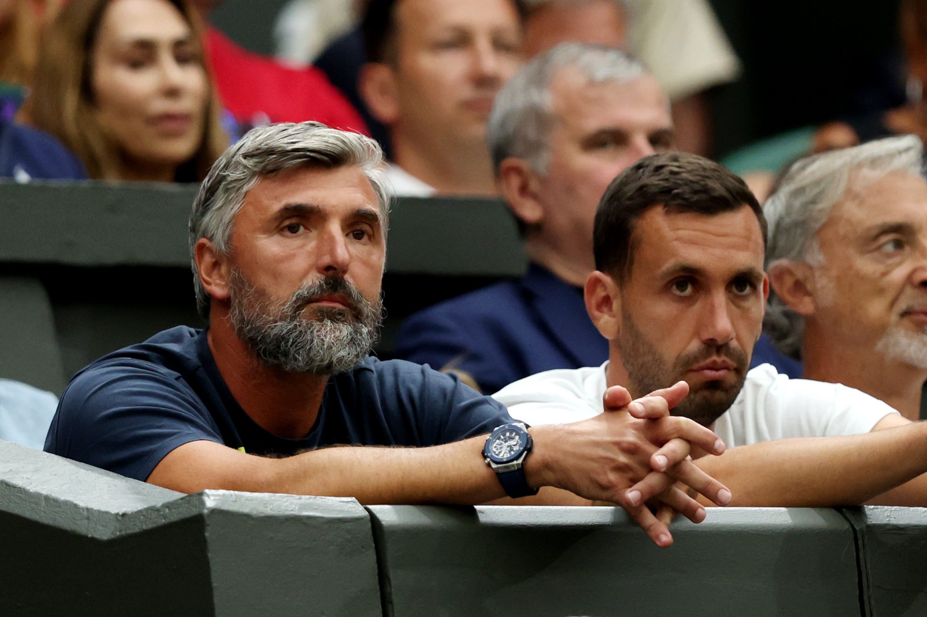 Djokovic’s coach Goran Ivanisevic (left) watches on at Wimbledon, where he was champion in 2001