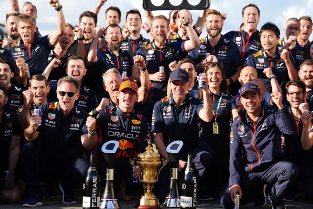 Red Bull celebrate at Silverstone after Max Verstappen, front row centre left, claimed the team’s 11th straight win on Sunday (Bradley Collyer/PA)