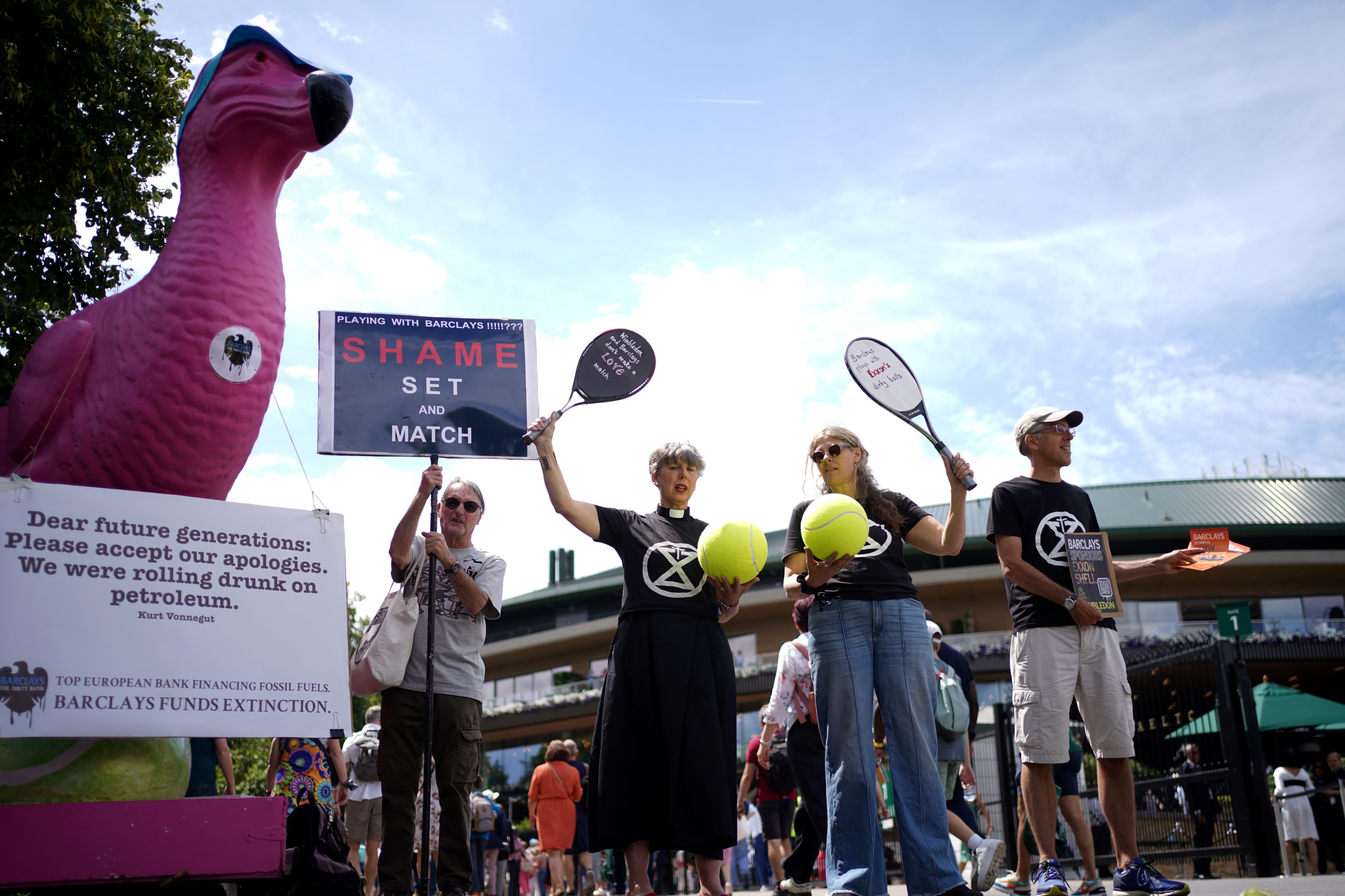 Protesters gathered outside Wimbledon’s first gate (Victoria Jones/PA)