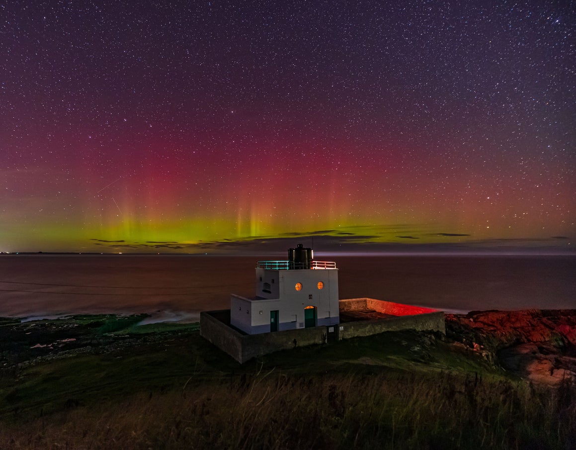 The Northern Lights over Bamburgh’s lighthouse