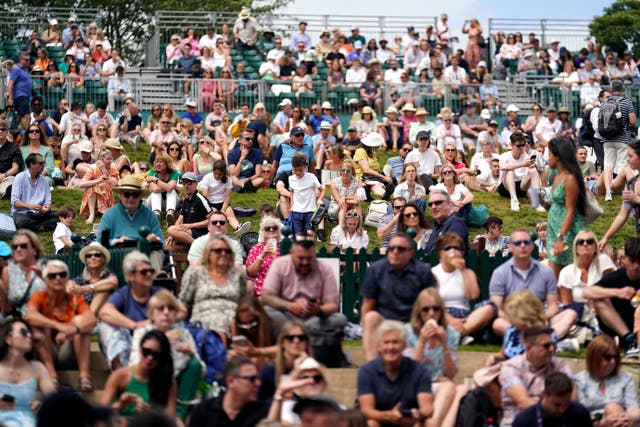 Spectators on the Hill on day eight of the 2023 Wimbledon Championships (Victoria Jones/PA)