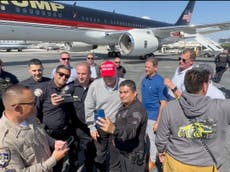 Blowback after Trump seen taking selfies with police officers