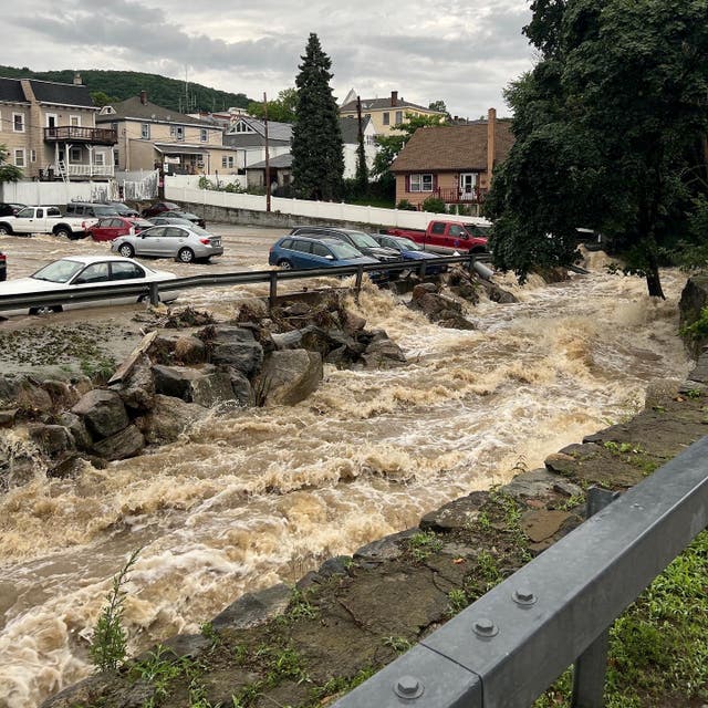 <p>Flooding surrounds a parking lot, in Highland Falls, Orange County, New York on July 9, 2023</p>