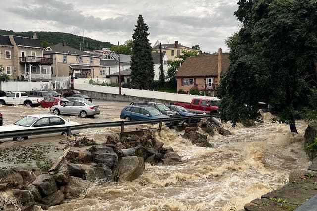 <p>Flooding surrounds a parking lot, in Highland Falls, Orange County, New York on July 9, 2023</p>